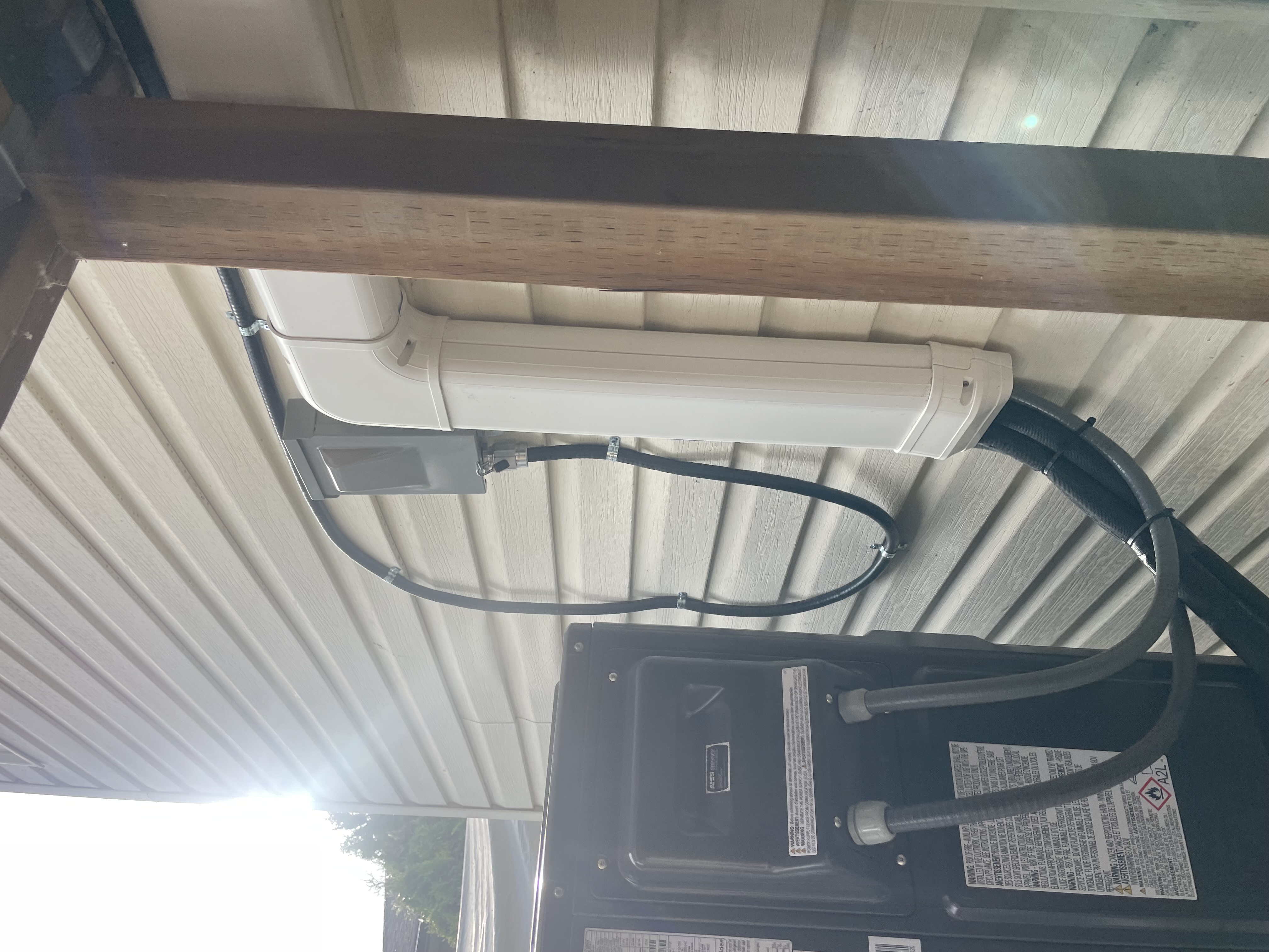 Disconnecting means and conduit installed under soffit — Gubond Electrical